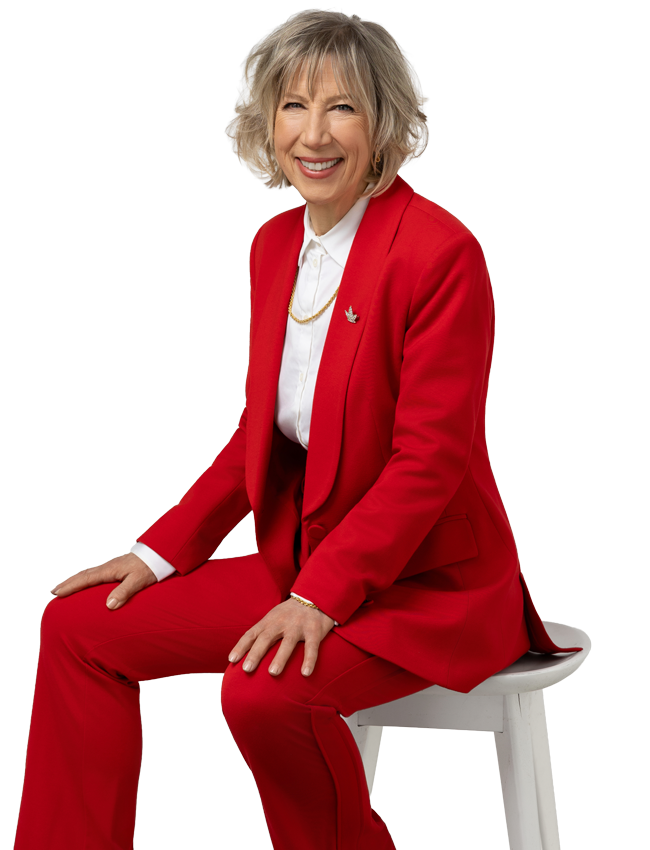 Portrait of Diane Sokolyk, conflict management coach, seated and smiling, conveying confidence and warmth.