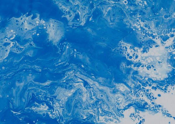 Abstract blue fluid texture illustrating movement, complexity, and transformation.