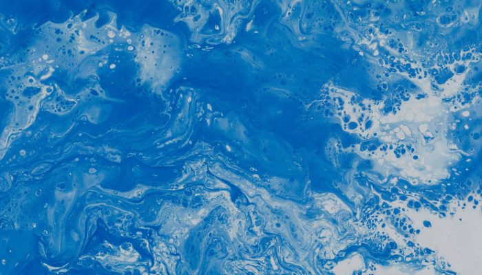 Abstract blue fluid texture illustrating movement, complexity, and transformation.
